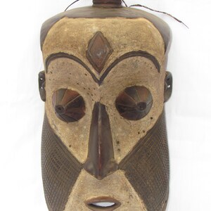 May include: A set of three ceramic mugs with a speckled, matte finish. The mugs are in cream, light grey, and dark grey. Each mug has a simple, minimalist design and a rounded handle.