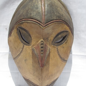 Vintage hand carved wall hanging African traditional wooden mask with a long nose from D.R.C.