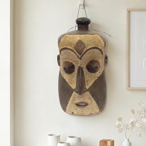 May include: A rectangular wooden sign, distressed for a rustic look, bearing the handwritten text "Welcome to our home". The sign is designed for indoor or outdoor use, offering a simple, welcoming message.