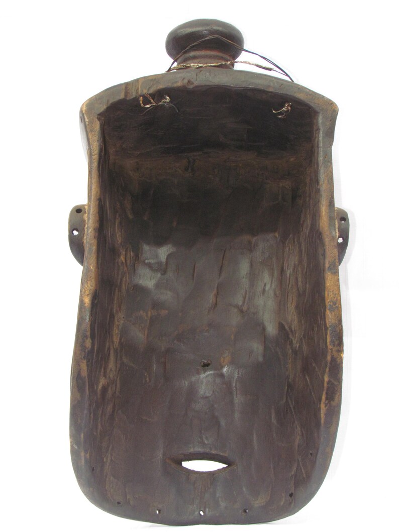 May include: A white ceramic mug with a black handle and the text "But First, Coffee" in a black, bold font. The mug is on a white surface.