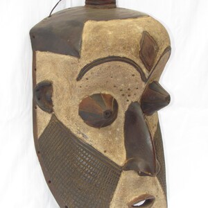 May include: A set of three ceramic mugs with a speckled, matte finish in cream, light grey, and dark grey. Each mug has a simple, minimalist design, suitable for coffee or tea.