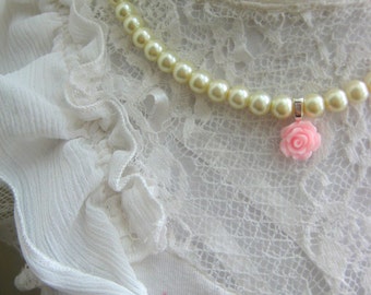 Glass pearl rose necklace.