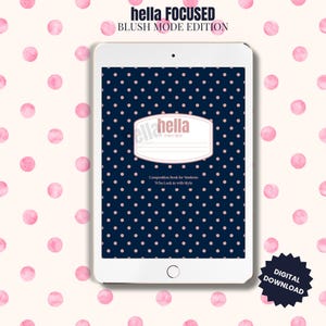 May include: A digital download of a composition book cover design. The cover is navy blue with pink polka dots and a white label with the text "hella FOCUSED". The background is a cream colour with pink polka dots. The text "BLUSH MODE EDITION" is at the top.