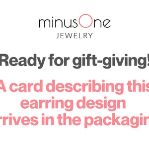 May include: White background with the text "minus One JEWELRY". The text "Ready for gift-giving!" is in dark gray. Below, in pink, it reads "A card describing this earring design arrives in the packaging."
