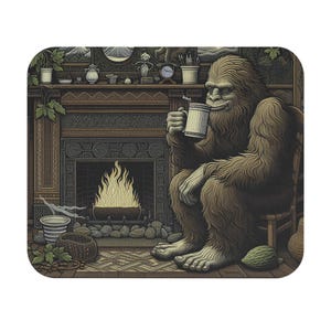 May include: A brown and tan Bigfoot character sits in a wooden chair by a fireplace. The fireplace has a roaring fire and a stone hearth. The Bigfoot is holding a mug of coffee or tea. The scene is set in a rustic cabin with a wooden mantle and a variety of decorative items.