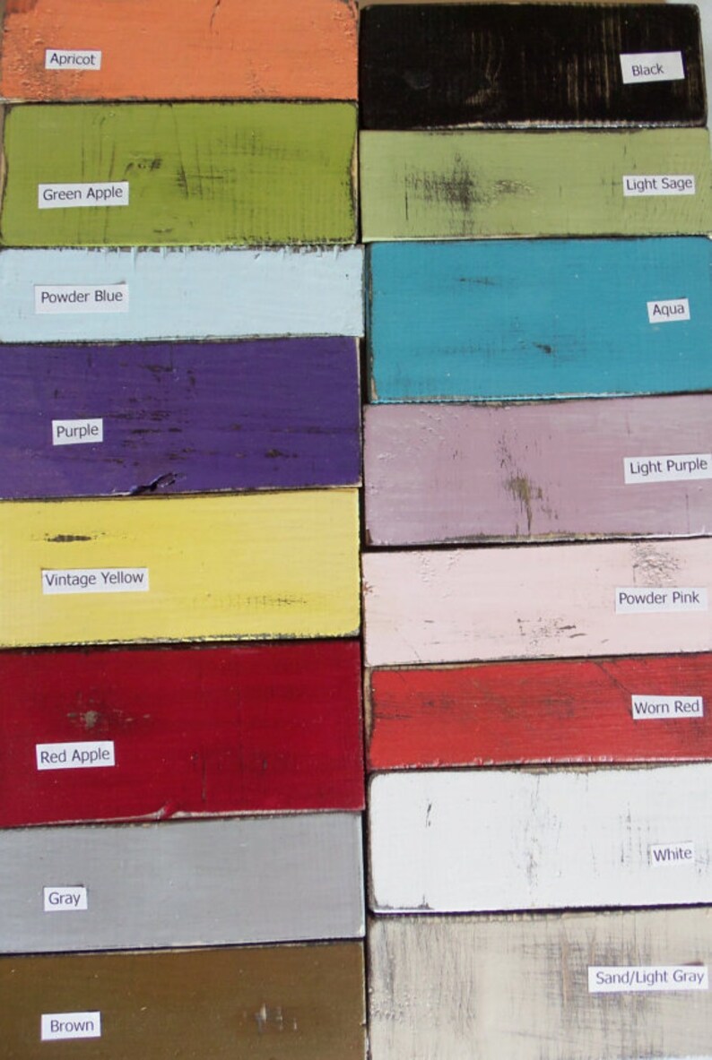 May include: A color chart with 14 different paint colors, including apricot, green apple, powder blue, purple, vintage yellow, red apple, gray, brown, black, light sage, aqua, light purple, powder pink, and white. The colors are displayed in two columns, with the names of the colors written below each swatch.