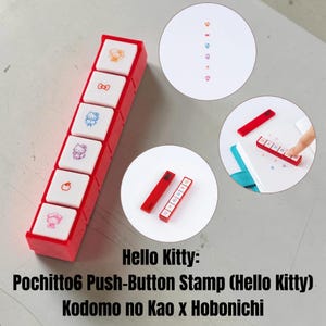 May include: A red and white Pochitto6 push-button stamp featuring Hello Kitty designs. The rectangular device has six white buttons, each displaying a different small icon, including Hello Kitty characters, a bow, and an apple in various colors.