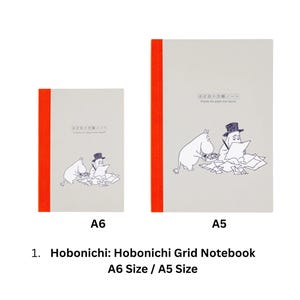 May include: Two light gray grid notebooks in A6 and A5 sizes, each featuring a bright orange spine and a black line drawing of Moomin characters with papers. The text "ほぼ日の方眼ノート" is printed on the front covers above the illustrations.