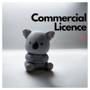May include: A 3D printed gray koala bear figurine with a black nose and brown ears. The figurine is sitting on a white surface. The text "Commercial Licence STL" is in the upper right corner of the image.