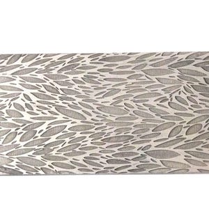 May include: A rectangular, silver-toned decorative panel with a repeating pattern of leaf-like shapes. The design is etched into the surface, creating a textured appearance. The panel is likely made of metal and is suitable for home decor.