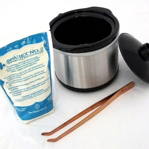 May include: A white plastic bag with blue lettering that reads "Sparex No. 2 Granular Dry Acid Compound" for pickling, cleaning and removing various tarnish, scale and corrosion from non-ferrous and precious metals (silver, copper, gold, etc.). A stainless steel crock pot with a black lid and a copper-colored pair of tweezers.
