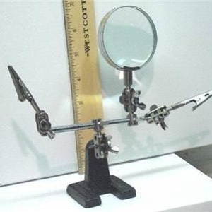 Helping Hand with Magnifying Glass