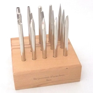 15 Bezel- Punch Repoussé, Chasing, Planishing, And Raising Set In Wood Base
