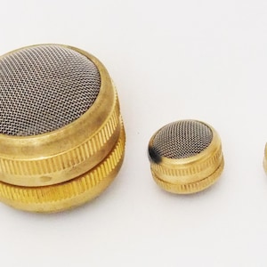 May include: Three brass mesh filters of different sizes. The largest filter is double-layered.
