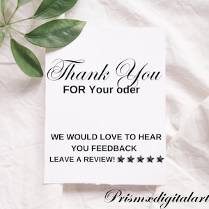 May include: A white card with black text that says "Thank You FOR Your oder WE WOULD LOVE TO HEAR YOU FEEDBACK LEAVE A REVIEW!" with five black stars below the text.