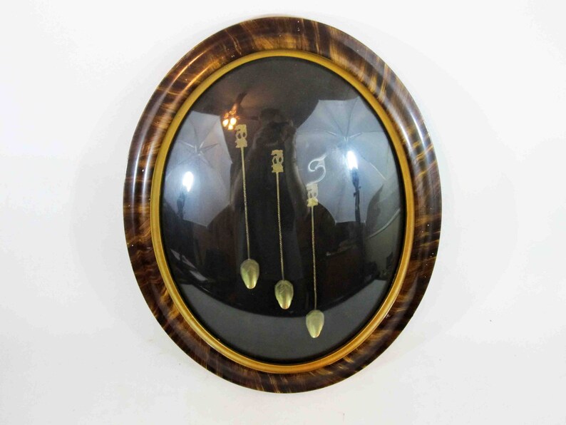Antique Set Of 3 Brass Tail Spoons Framed In Oval Image 0