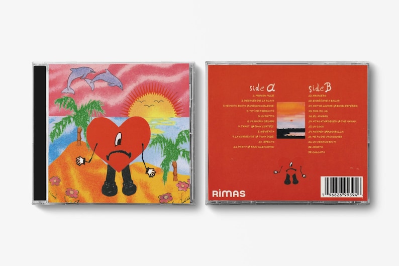 May include: CD case featuring a cartoon heart character on a beach scene with dolphins, palm trees, and a sunset. The back of the case is red with song titles and the Rimas logo.