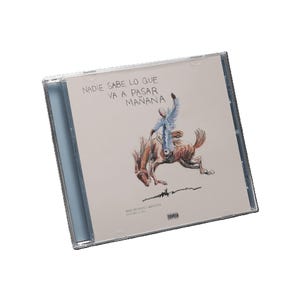 May include: A CD case featuring a drawing of a person riding a horse, with the text "NADIE SABE LO QUE VA A PASAR MAÑANA" at the top. The artist's name and album release date are at the bottom. The case is clear plastic.