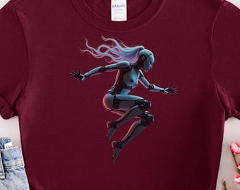 May include: A maroon t-shirt with a graphic print of a blue and white cyborg woman with long hair jumping in the air.