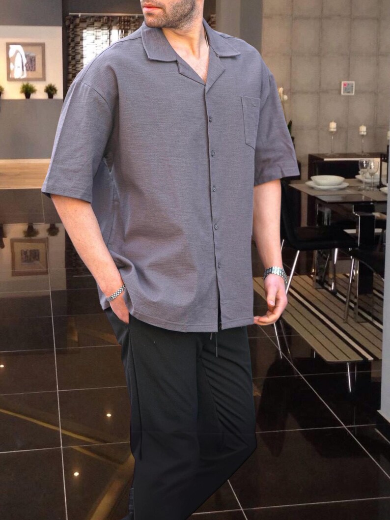 Crafted from high-quality, breathable cotton blend fabric, this stylish shirt offers a soft touch against the skin while ensuring durability. Designed with a relaxed fit, it falls perfectly over the shoulders for that effortlessly chic look. Whether you're lounging at home, running errands, or meeting friends for brunch