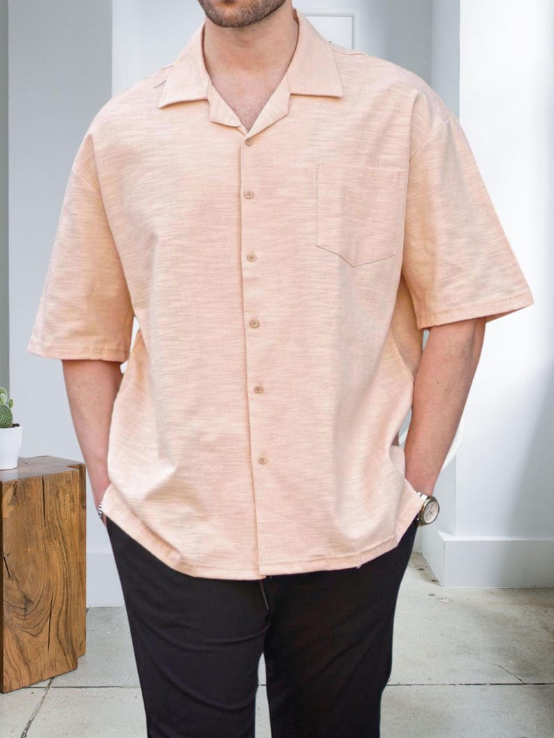Crafted from high-quality, breathable cotton blend fabric, this stylish shirt offers a soft touch against the skin while ensuring durability. Designed with a relaxed fit, it falls perfectly over the shoulders for that effortlessly chic look. Whether you're lounging at home, running errands, or meeting friends for brunch