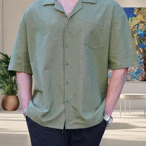 Crafted from high-quality, breathable cotton blend fabric, this stylish shirt offers a soft touch against the skin while ensuring durability. Designed with a relaxed fit, it falls perfectly over the shoulders for that effortlessly chic look. Whether you're lounging at home, running errands, or meeting friends for brunch