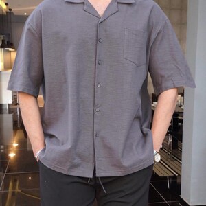 Crafted from high-quality, breathable cotton blend fabric, this stylish shirt offers a soft touch against the skin while ensuring durability. Designed with a relaxed fit, it falls perfectly over the shoulders for that effortlessly chic look. Whether you're lounging at home, running errands, or meeting friends for brunch