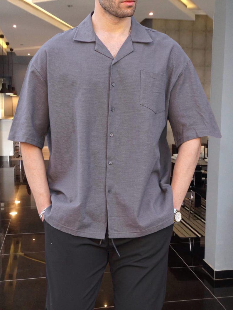 Crafted from high-quality, breathable cotton blend fabric, this stylish shirt offers a soft touch against the skin while ensuring durability. Designed with a relaxed fit, it falls perfectly over the shoulders for that effortlessly chic look. Whether you're lounging at home, running errands, or meeting friends for brunch