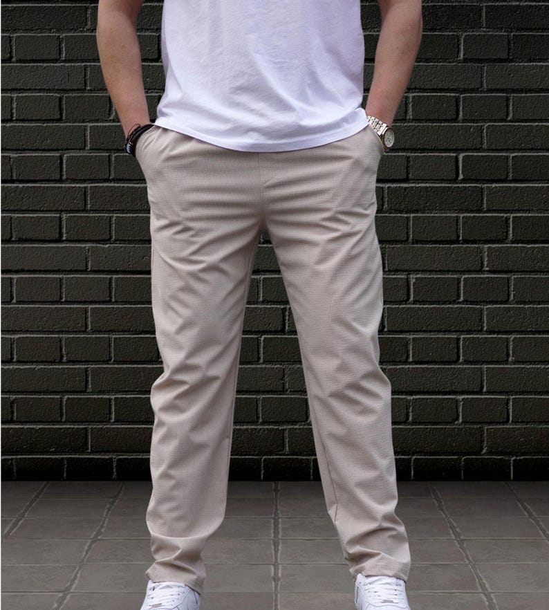 Crafted from a premium blend of soft cotton and a hint of stretch, these lounge trousers ensure a relaxed fit that moves with you. Perfectly suited for lounging at home or stepping out with friends, these classic pants redefine casual wear, making them a versatile addition to any man's closet.