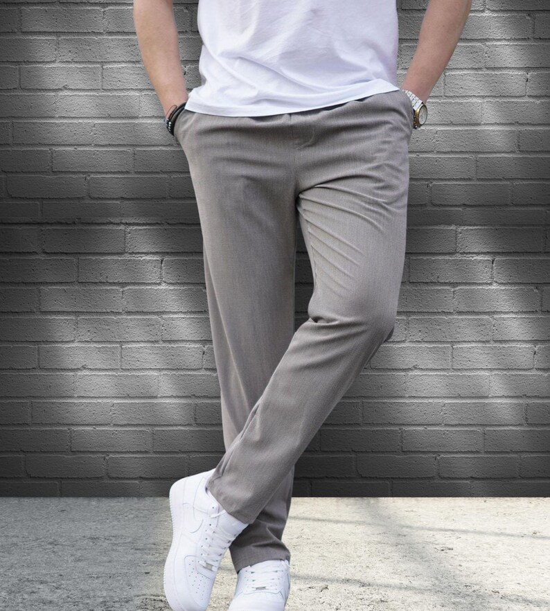 Crafted from a premium blend of soft cotton and a hint of stretch, these lounge trousers ensure a relaxed fit that moves with you. Perfectly suited for lounging at home or stepping out with friends, these classic pants redefine casual wear, making them a versatile addition to any man's closet.