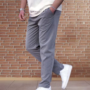Crafted from a premium blend of soft cotton and a hint of stretch, these lounge trousers ensure a relaxed fit that moves with you. Perfectly suited for lounging at home or stepping out with friends, these classic pants redefine casual wear, making them a versatile addition to any man's closet.