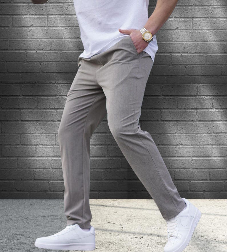 Crafted from a premium blend of soft cotton and a hint of stretch, these lounge trousers ensure a relaxed fit that moves with you. Perfectly suited for lounging at home or stepping out with friends, these classic pants redefine casual wear, making them a versatile addition to any man's closet.