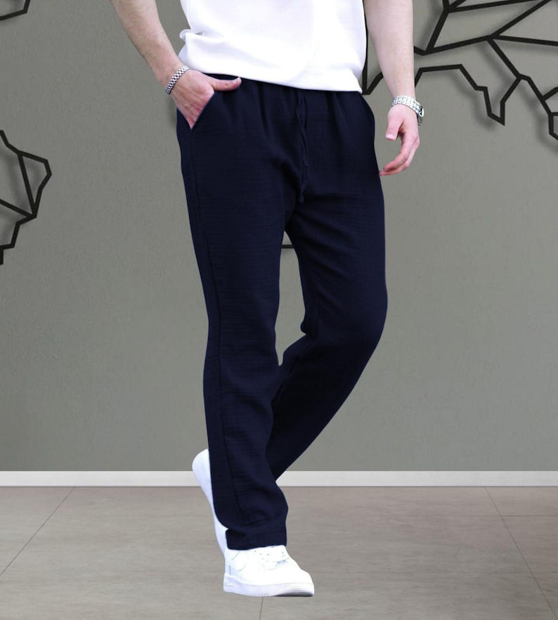 Elevate your casual wardrobe with our Muslin Fabric Men's Basic Trousers! Designed for ultimate comfort, these relaxed fit cotton pants are perfect for warm summer days. Featuring a breathable muslin material, they offer a laid-back, stylish look while ensuring you stay cool. Whether you're heading to the beach or lounging at home, these trousers are your go-to choice for effortless summer style. Available in various sizes, they combine versatility and comfort in one must-have piece!