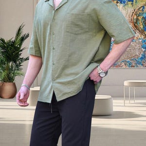 Crafted from high-quality, breathable cotton blend fabric, this stylish shirt offers a soft touch against the skin while ensuring durability. Designed with a relaxed fit, it falls perfectly over the shoulders for that effortlessly chic look. Whether you're lounging at home, running errands, or meeting friends for brunch