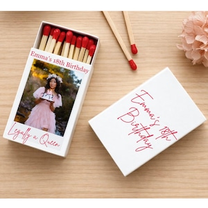 May include: White matchbox with the text "Emma's 18th Birthday" in red script. The box features a photo of a person in a pink dress. The matches have red tips. The words "Legally a Queen" are also visible.