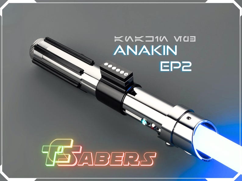 May include: A silver and black lightsaber with a bright blue blade. The text "ANAKIN EP2" is displayed above the hilt. The logo "FSabers" is at the bottom. The lightsaber is a prop from the Star Wars franchise.