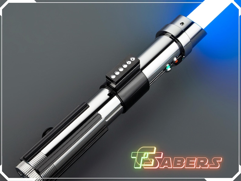 May include: A silver and black lightsaber with a bright blue blade. The hilt features a series of buttons and lights. The image includes the text "TSABERS" in a neon-style font.