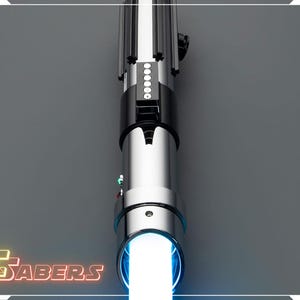 May include: A silver and black lightsaber with a bright white blade emanating from the hilt. The hilt features a black grip, silver accents, and a series of illuminated buttons. The logo "FSABERS" is visible in the lower left corner.
