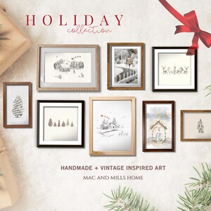 May include: A collection of eight framed illustrations with a winter holiday theme. The illustrations feature scenes of snow-covered houses, trees, and a nativity scene. The frames are all different colors and styles. The text "HOLIDAY collection" is at the top of the image. The text "HANDMADE + VINTAGE INSPIRED ART" and "MAC AND MILLS HOME" are at the bottom of the image.