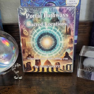 May include: A colorful card deck box with the title "Portal Pathways Sacred Locations" and the text "Where is your soul calling you? By: SassyLux3333".