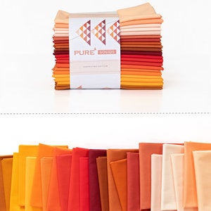 May include: A stack of 20 fabric squares in various shades of orange, red, and peach. The fabric squares are packaged together and labeled "Pure Solids Harvesting Edition".