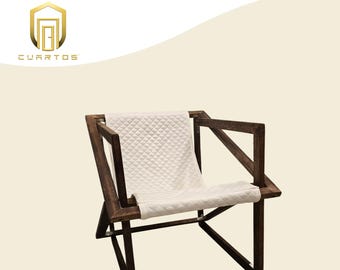 Sling chair with white quilted cushion. Indoor or Outdoor use