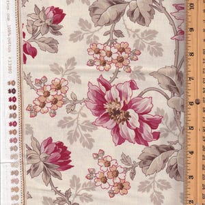 May include: Floral fabric with a cream background and a pattern of large, deep pink and light pink flowers, along with smaller clusters of peach-colored blossoms and gray leaves. The fabric has a border with a decorative edge.