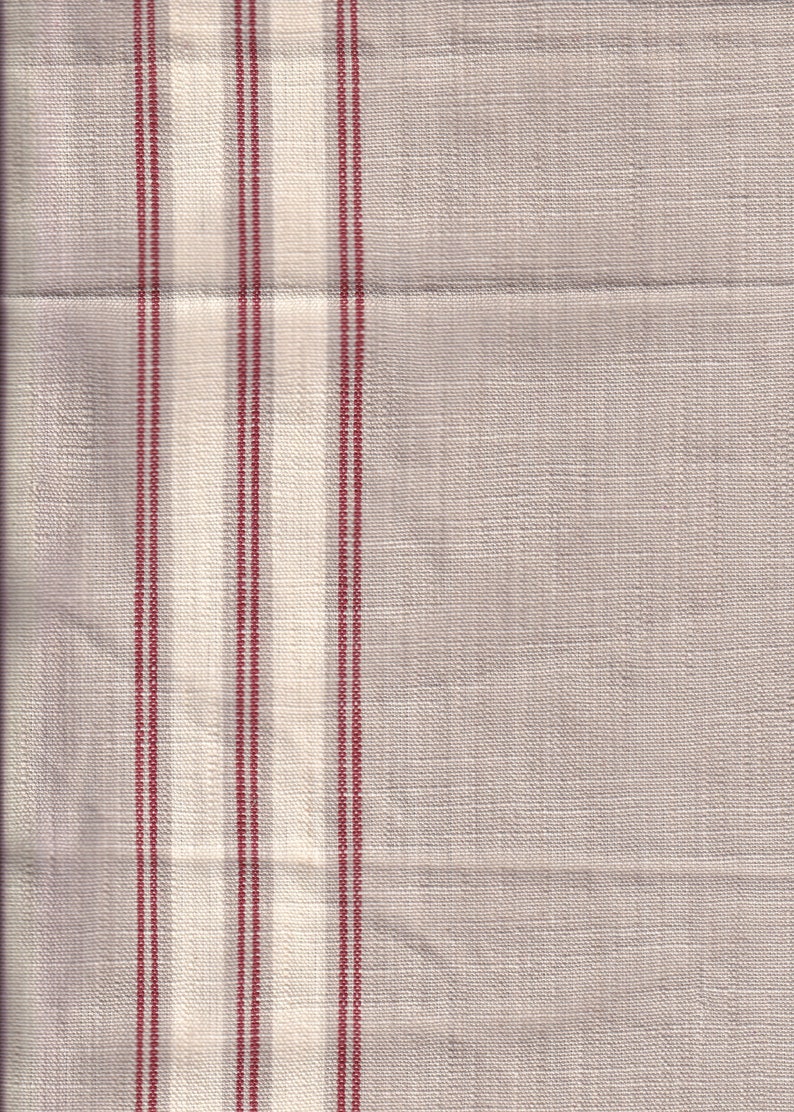 May include: A close-up of a white fabric with thin red stripes. The fabric has a subtle texture and a slightly off-white color.