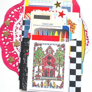 May include: A collection of assorted paper ephemera and cards featuring a schoolhouse illustration with the text 7 DAY USE RETURN TO DESK FROM WHICH BORROWED EDUCATION LIBRARY, colorful crayon graphics, and a black and white checkered pattern.
