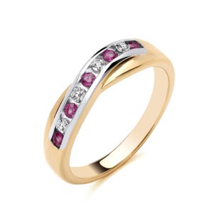 May include: A gold and white band ring with a row of pink gemstones and smaller white gemstones.
