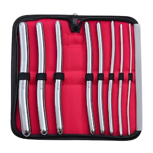May include: A black zippered case with a red interior holds a set of eight curved metal medical instruments. The instruments are labeled with the text "MTWCE" and various sizes.