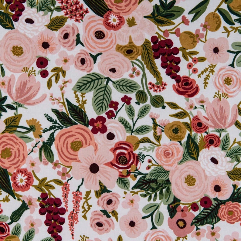 May include: A floral pattern featuring a variety of flowers in shades of pink, peach, and burgundy, set against a white background. The design includes roses, peonies, and other blossoms with green leaves and accents.