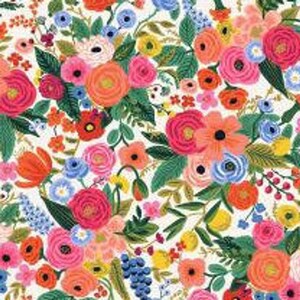 May include: A white background with a colourful floral pattern. The flowers are in shades of pink, red, orange, yellow, blue, and green. The pattern is repeated throughout the fabric.