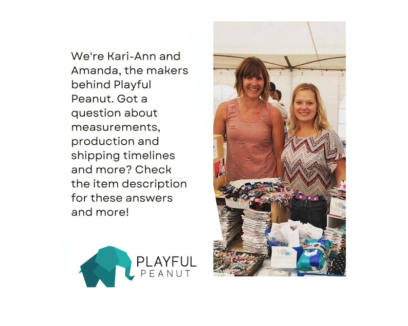 May include: Two women stand behind a table displaying colourful fabric items. The table is covered with a white tablecloth. The women are smiling and looking at the camera. The text "We're Kari-Ann and Amanda, the makers behind Playful Peanut. Got a question about measurements, production and shipping timelines and more? Check the item description for these answers and more!" is visible in the image. The text "PLAYFUL PEANUT" is also visible in the image.